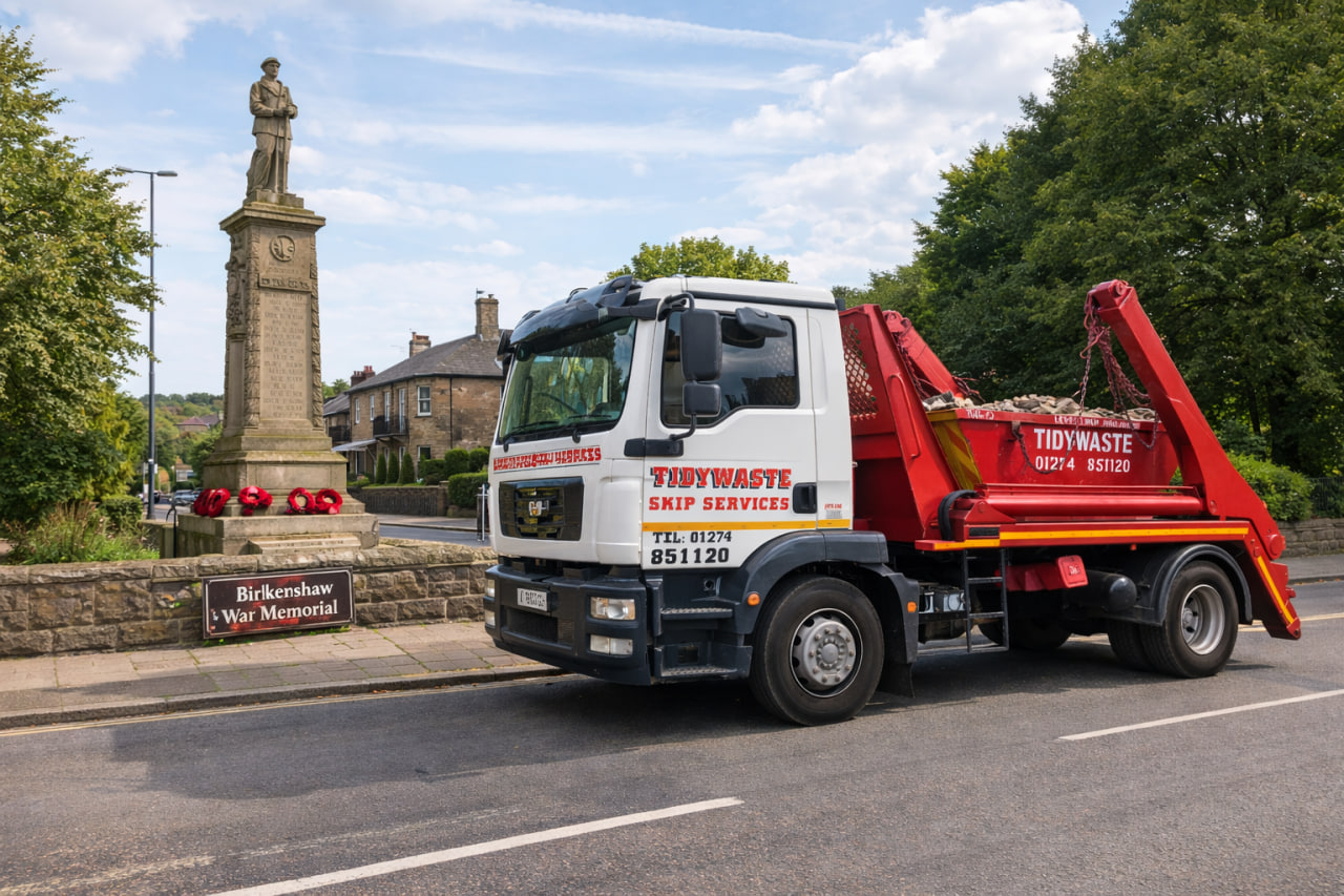 TidyWaste Skip Hire Vehicle next to Birkenshaw War Memorial in Birkenshaw